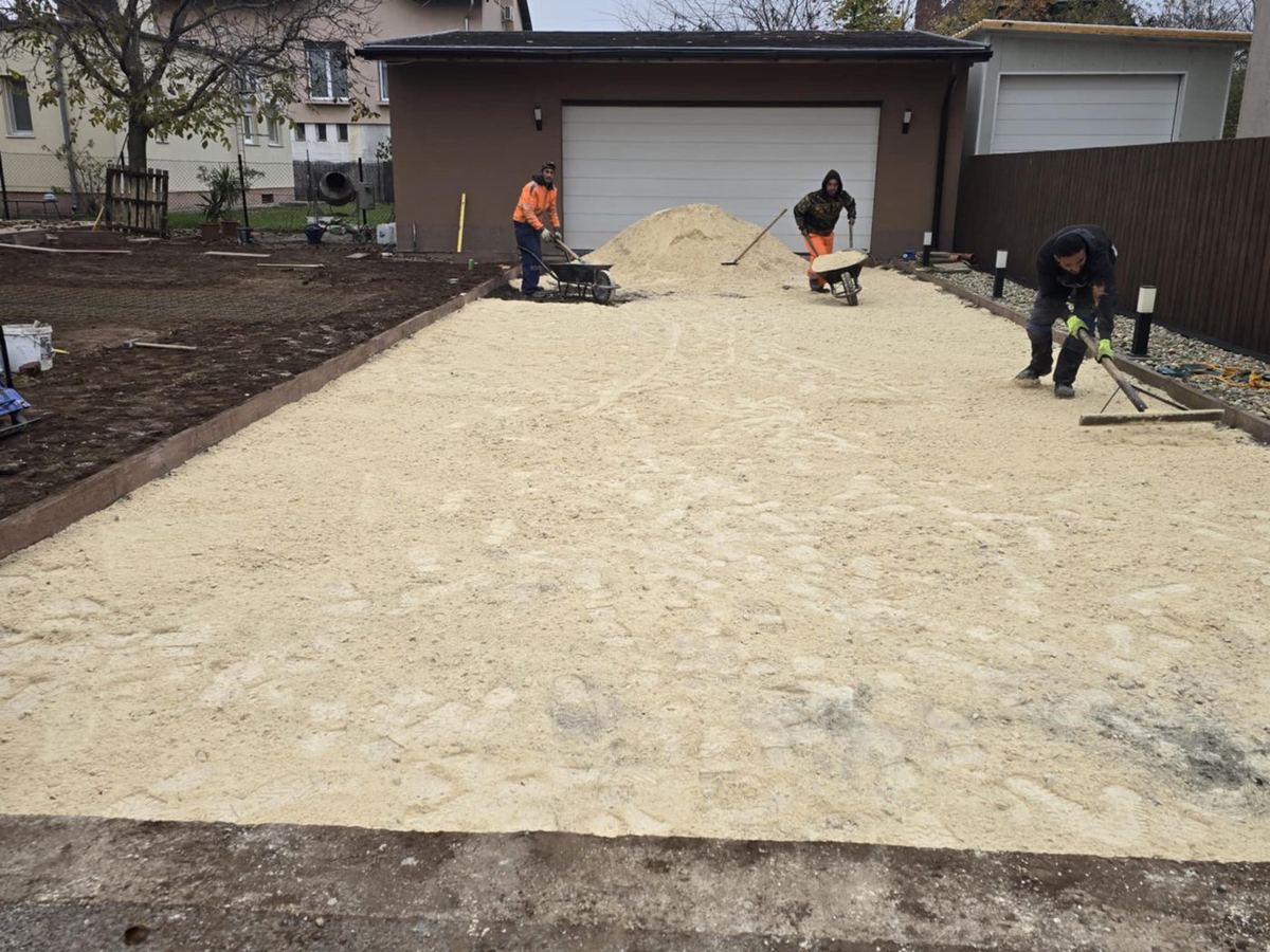 Spreading the granular sub-base in front of a garage